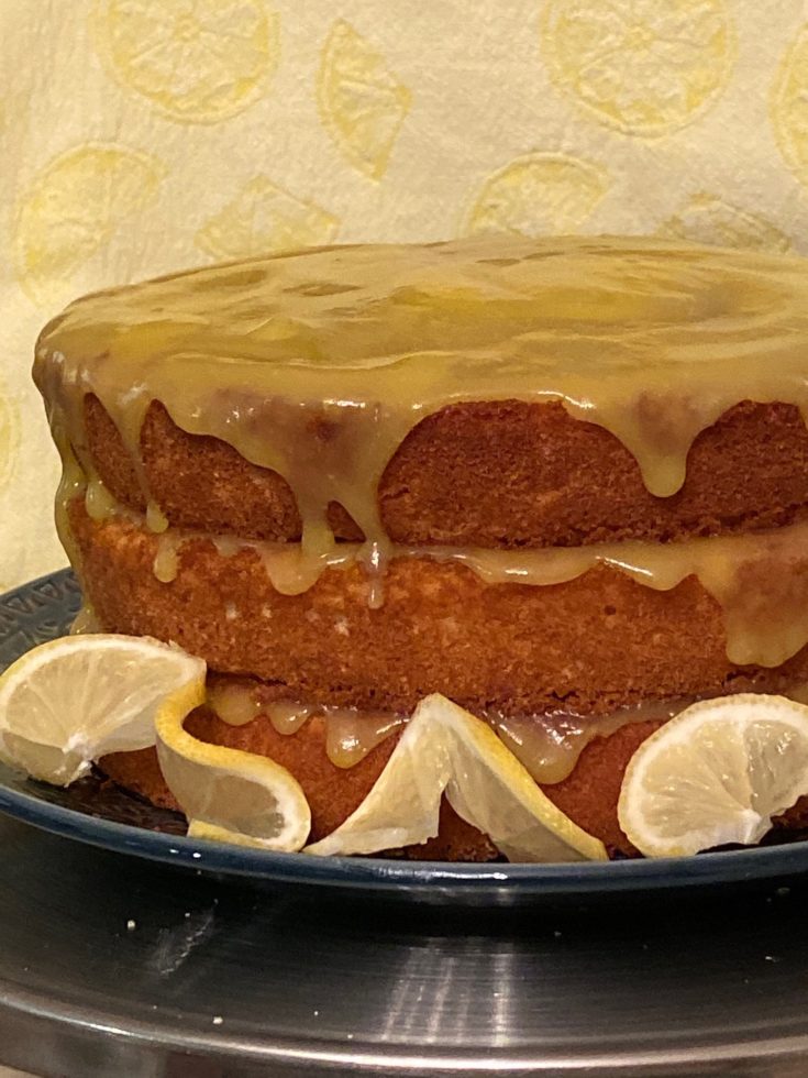 white three layer cake with thin lemon filling